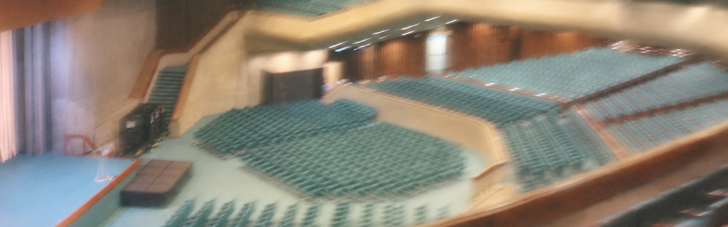 Rows of seats in an auditorium facing the stage